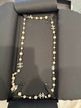 CHANEL Long Pearl Station Necklace with Silver CC Logos